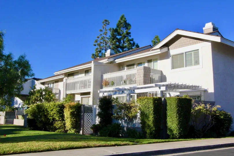 A street view of a home and landscaped yard on a sunny day at Willow Creek