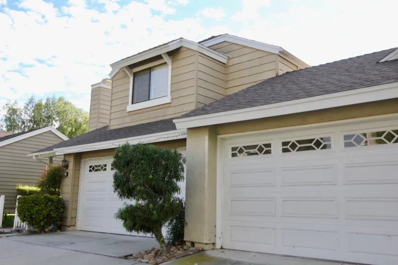 A two-storey residence in Windwood Garden Homes community with horizontal cladding.