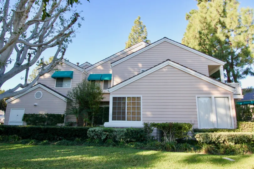 A sunny day in the area of Woodbridge Cove, outside, condo, trees, awning, sky, windows