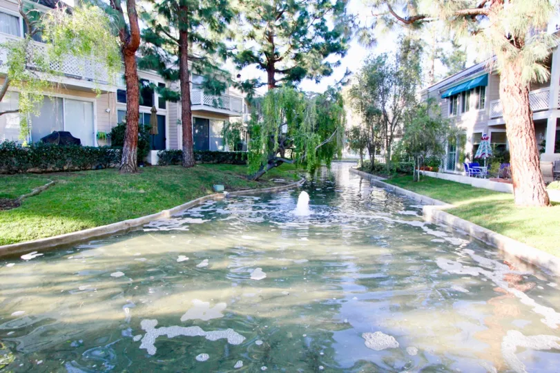 a man-made stream through complex buildings in Woodbridge Cove