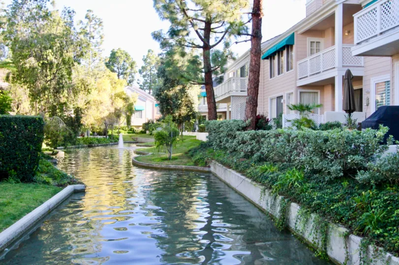 A narrow river alongside townhouses in Woodbridge Cove community.