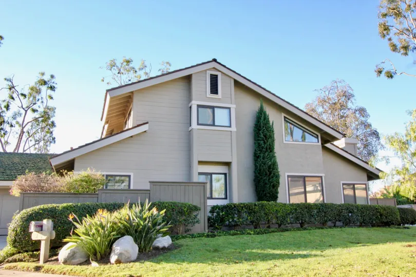 Three story with two level roof inside Woodbridge Crossing in Irvine CA