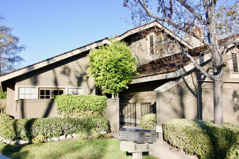 Two story brown family home in Woodbridge Crossing, Irvine CA