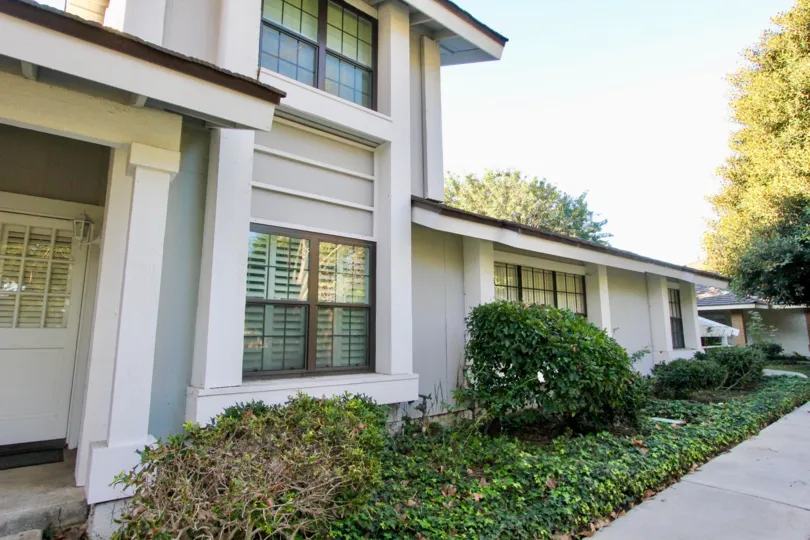 A two-and-a-half storey residence in the Woodbridge Estates community with louvered windows.