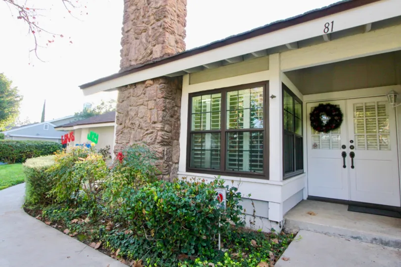 Beautiful front door entrance with cozy fireplace in Woodbridge Estates