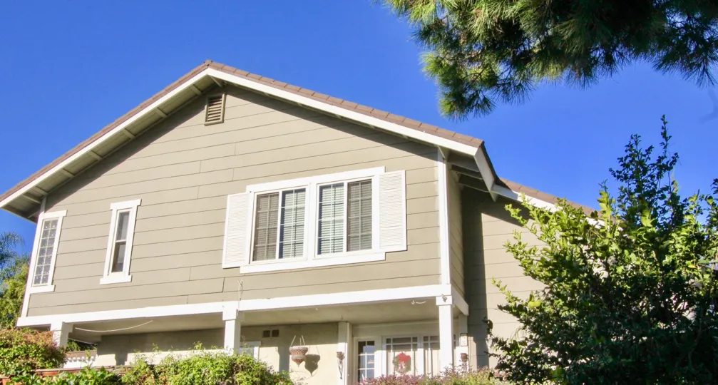 Blue skies over a two-story home in the Woodbridge Estates neighborhood