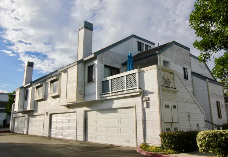 Old style house in Woodbridge Laurels community with two smoke chimneys
