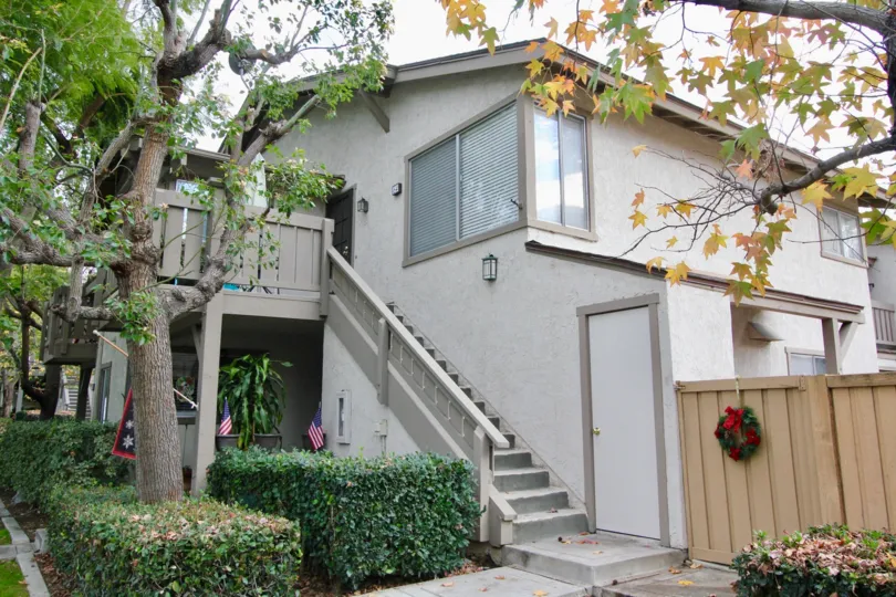 Christmas wreath and staircase of a Woodbridge Reserve home located in Irvine, California.
