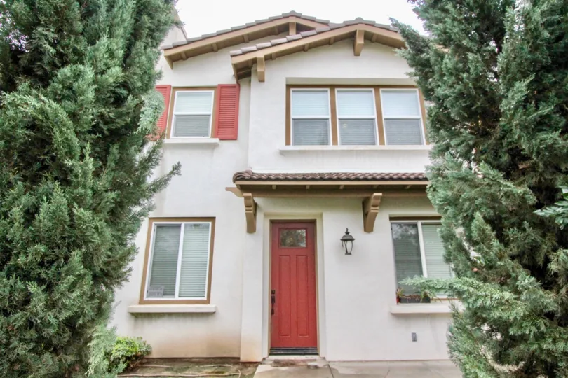 THE FRONT VIEW OF THE HOME WITH LIGHT, ON THE BOTHSIDE TREES ARE PRESENT IN LA HABRA CITY