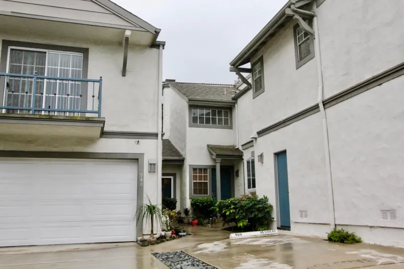 White painted house in Country Terrace community with many windows on a clear day