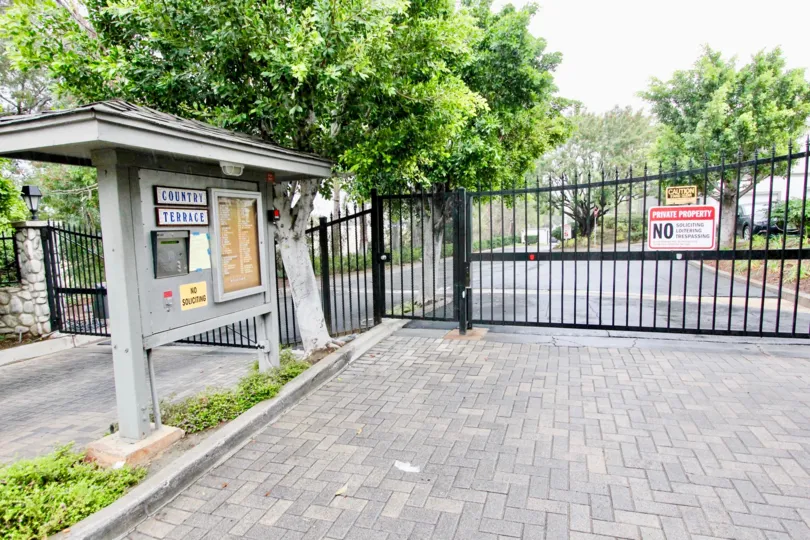 THIS IMAGE SHOWS ENTRANCE WAY WHICH HAVE THE LOT OF PLANTS AND TREES IS LOCATED IN LA HABRA