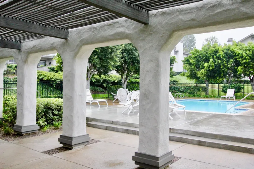 A estate in country terrace with swimming pools, plants, trees and chairs