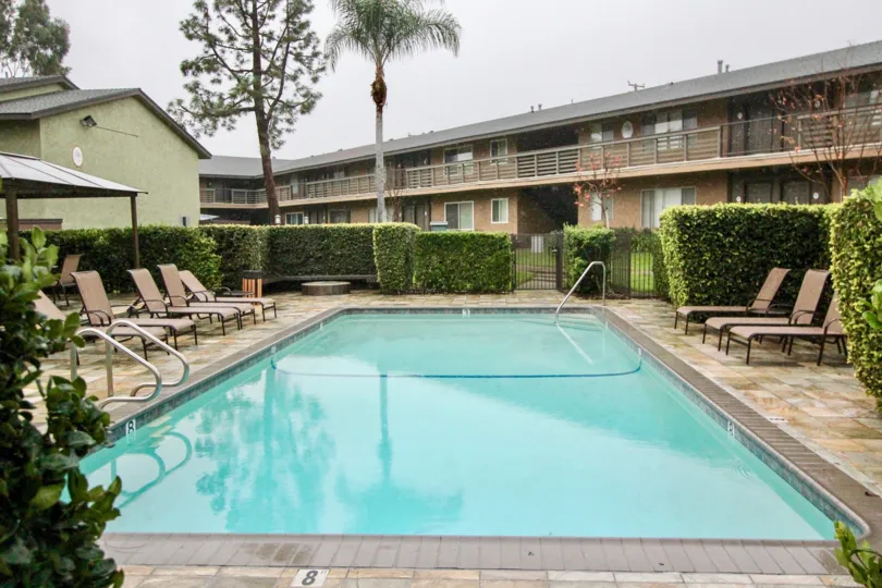 The restaurant in creekside village with swimming pool and lots of loungers, plants