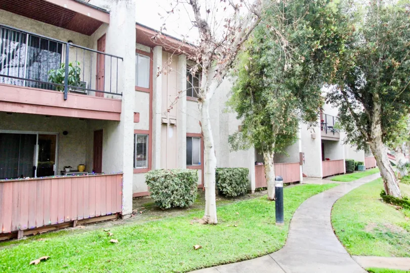 THE SIDE ON THE HOUSE WITH LAWN, TREES, PLANTS ARE THERE IN FASHION HEIGHTS COMMUNITY