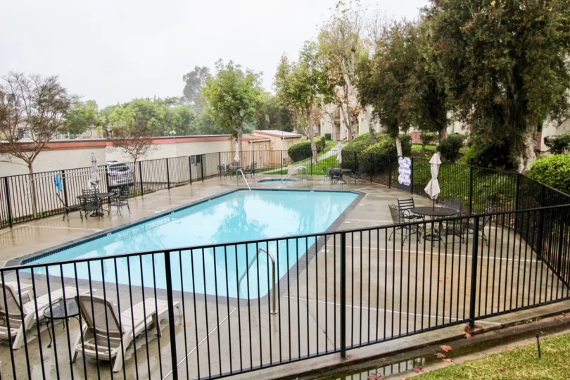 Rectangular swimming pool amid the park in Yoldash community