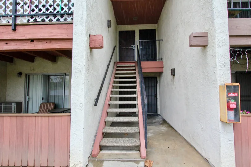 A staircase in the Fashion Heights with a window.