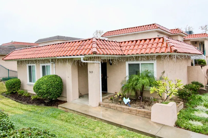THE SMALL HOME WITH BEAUTIFUL LAWN, SMALL PLANTS, NUMBER ON THE WALL, ARE IN LA HABRA CITY