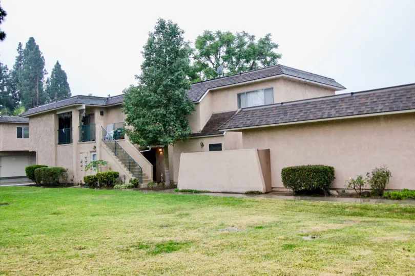 a pleasant day in the fashion knolls with a house that has steps in left side and garden around