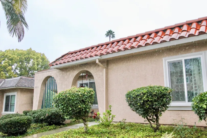 THE FRONT OF THE HOUSE IN LA HABRA THAT HAVE THE LAWN AND PLANTS LIKE CROTONS ARE THERE