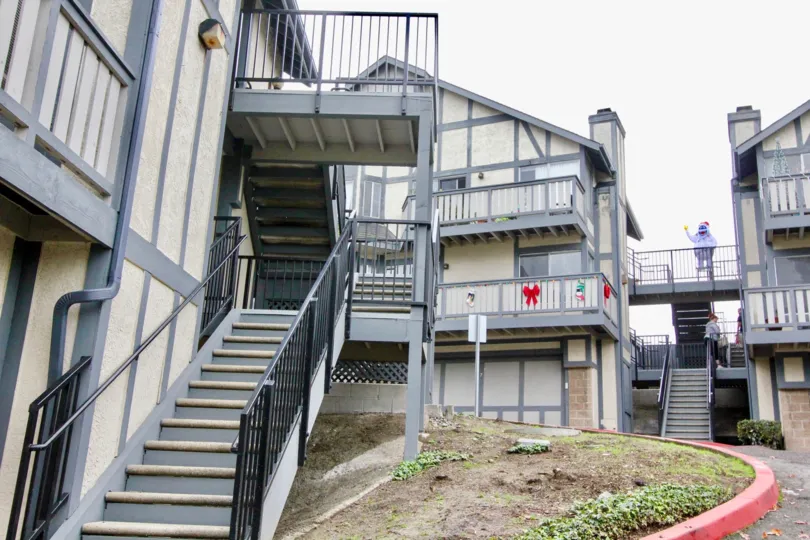 a pleasant day in the Heritage Walnut with a building steps in center and balcony