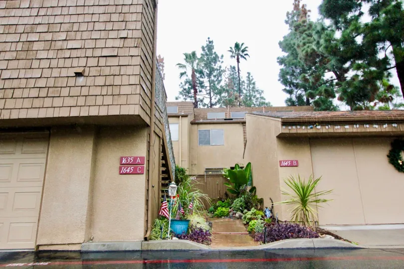THE ENTRANCE OF THE HOUSE ON THE FRONT LIGHT LAMP, PLANTS, NUMBER ON THE WALL IS THERE IN LA HABRA CITY