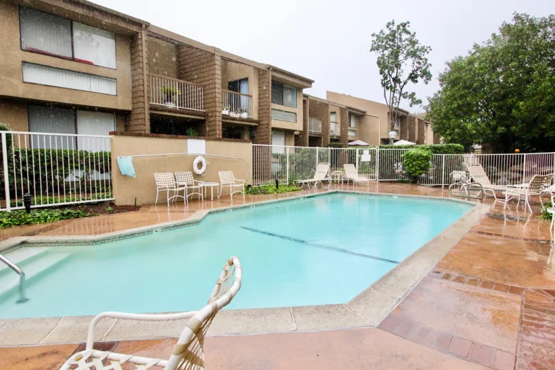 THE FLAT IN THE HIDDEN VILLAGE WITH THE SWIMMING POOL, CHAIRS, PLANTS, TREES