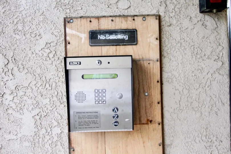 Inside a room in the La Harba Woods with a machine on the wall.