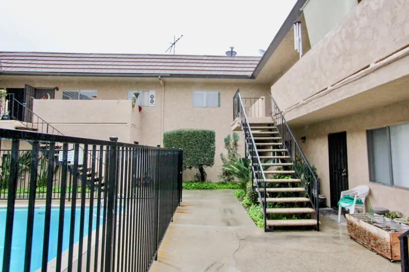 Stairs leading to the enclosed pool at the La Venezia community in La Habra