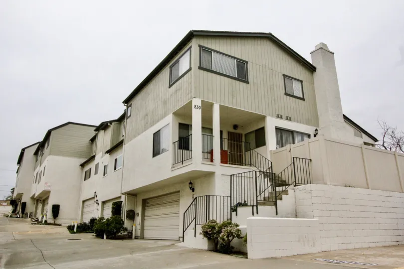 THIS IMAGE SHOWS THE FLAT IN LA HABRA WHICH SHOWS THE NUMBER ON THE WALL, SMALL PLANTS, SHEDS FOR EACH FLAT