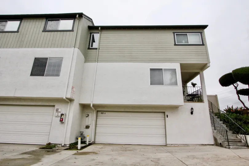 THE HOUSE WITH SHED LOCATED IN LAKEVIEW TOWNHOMES THAT SHOWS THE PLANTS ON THE RIGHT