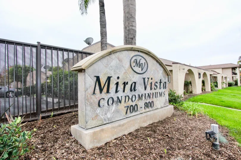 A day in the Mira Vista with a sign in front of a building.