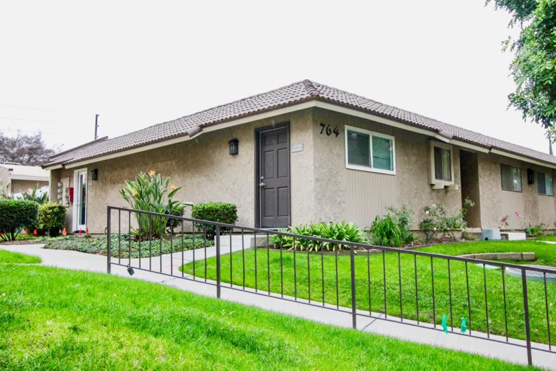 THIS IMAGE SHOWS THE HOME WITH BEAUTIFUL LAWN, PLANTS, NUMBER ON THE WALL ARE THERE IN LA HABRA CITY