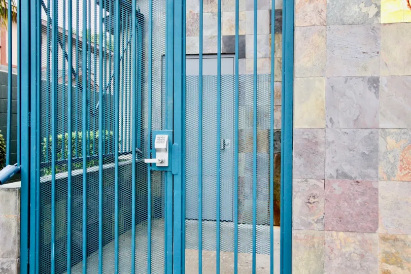 Gate of the House is painted with blue color placed in Mountain View Villas