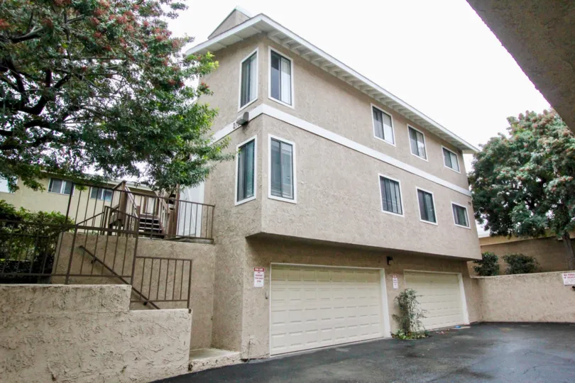THE SIDE VIEW OF THE HOME WITH SHEDS IN LA HABRA, THAT SHOWS THE TREES