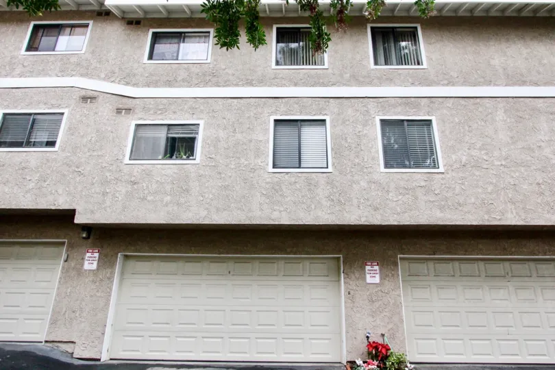 THIS IMAGE SHOWS THE FLATS UNDER THE SHEDS IN LA HABRA THAT HAVE THE GLASS WINDOWS SMALL PLANTS ON THE TOP