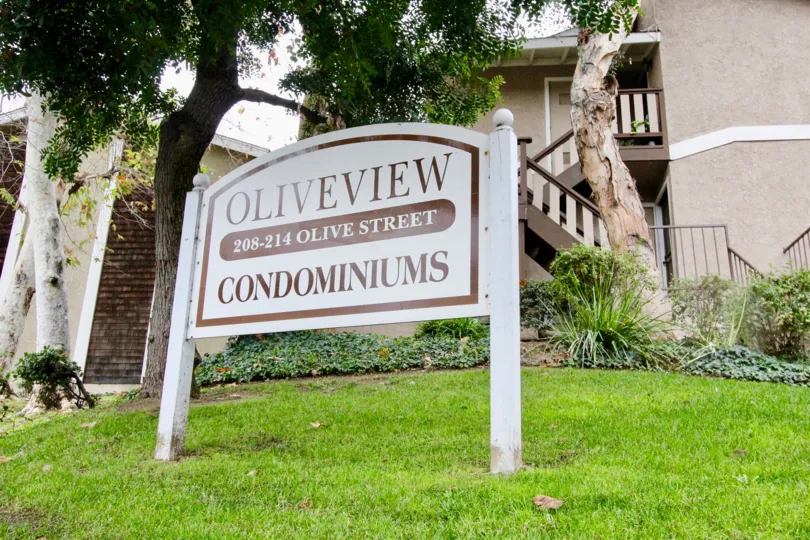 Street board is placed in the meadow at front of the house in Oliveview