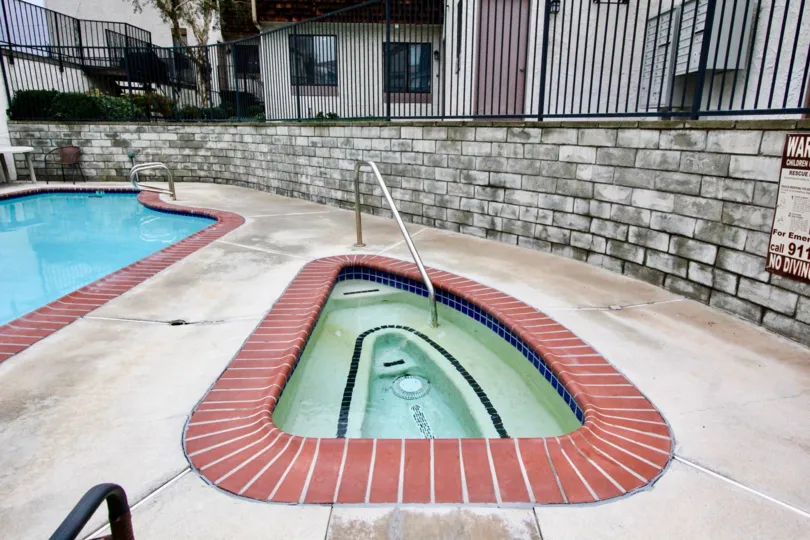 Swimming pool area with clean water and kids pool in Parkside Townhomes of La Habra city of california