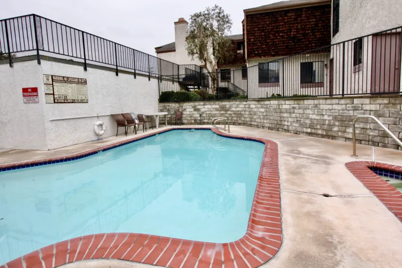 Swimming Pools are present in the Parkside Townhomes with seating chairs for both child's and adult's