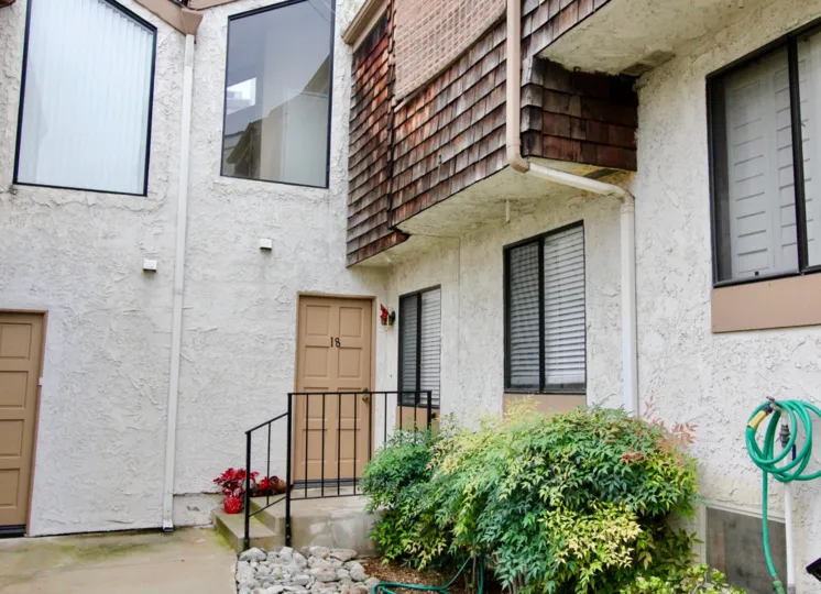 A flower pot is broken placed near the entrance door of 18 th villa in Parkside Townhomes