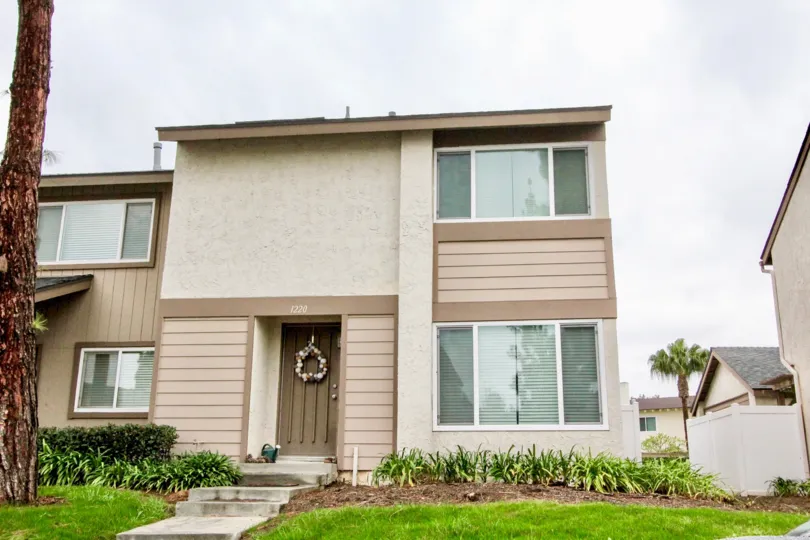 THE HOUSE WITH LAWN, SMALL PLANTS ON THE FRONT, NUMBER ON THE WALL IS LOCATED IN LA HABRA