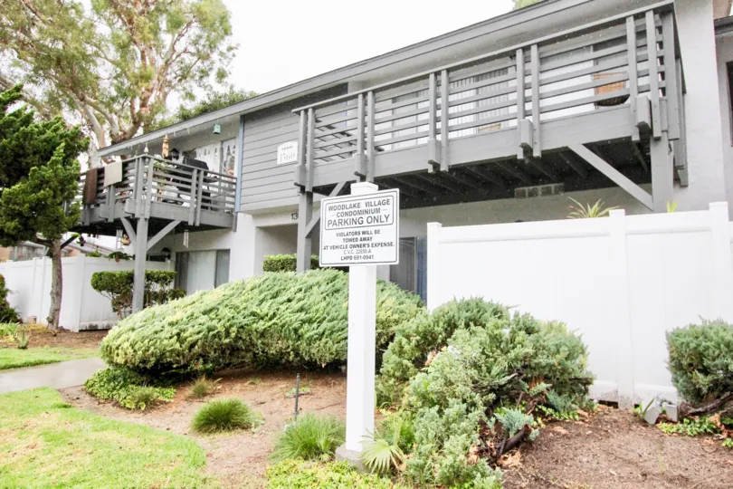 A cottage in woodlake village is in peaceful place with splendid lawn, plants and no parking board