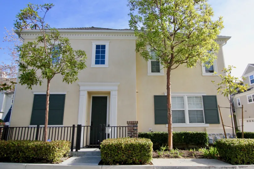 A cream colored two story home in Aldenhouse community in Ladera Ranch, California.