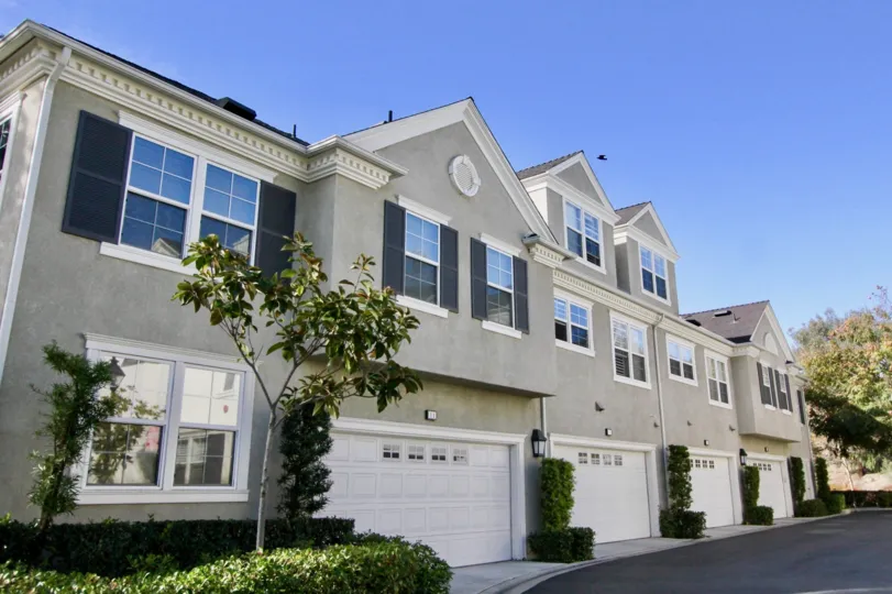 Front view with two car garages and plenty of windows at Aldenhouse in Ladera Ranch, California