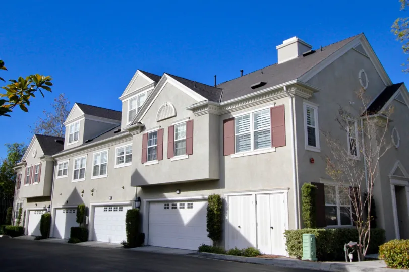 Blue skies and row of homes at Aidenhouse in Ladera Ranch, CA