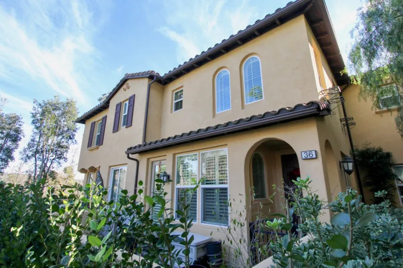 A sunny day in the area of Atherton Glen, condo, outside, door, trees, porch light, windows, blinds