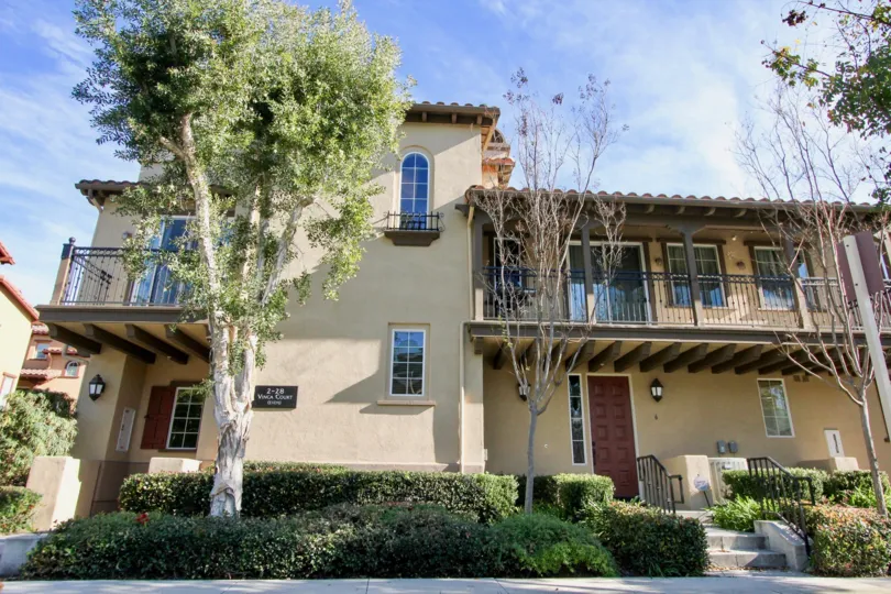 Spanish architecture with steps leading to doorway at Berkshire in Ladera Ranch, California