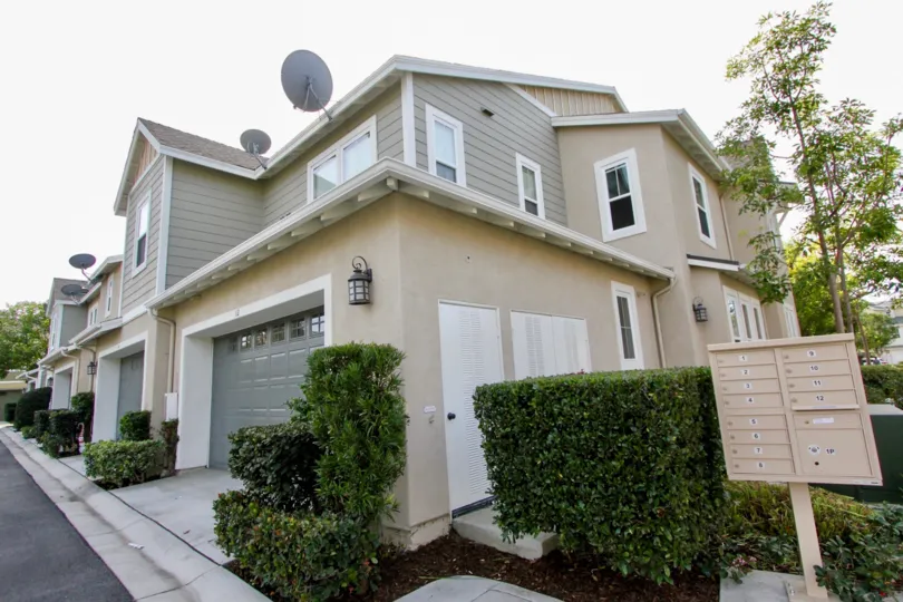 The corner view of garages, side entry door and mailboxes at Branches in Ladera Ranch, California