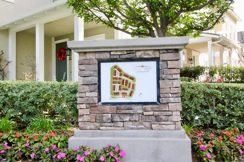 A map sits on a brick pillar in The Branches townhome community