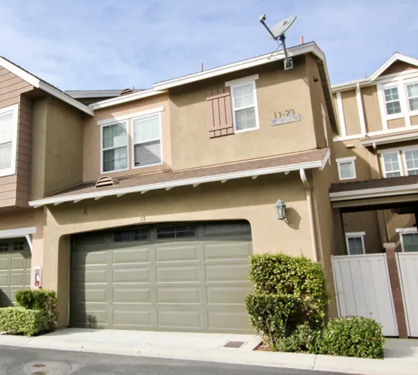 A brown home with a grey garage in Branches community in Ladera Ranch, California.