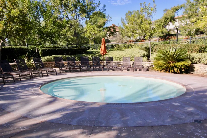 Chairs and pool at the Castellina in Ladera Ranch, CA